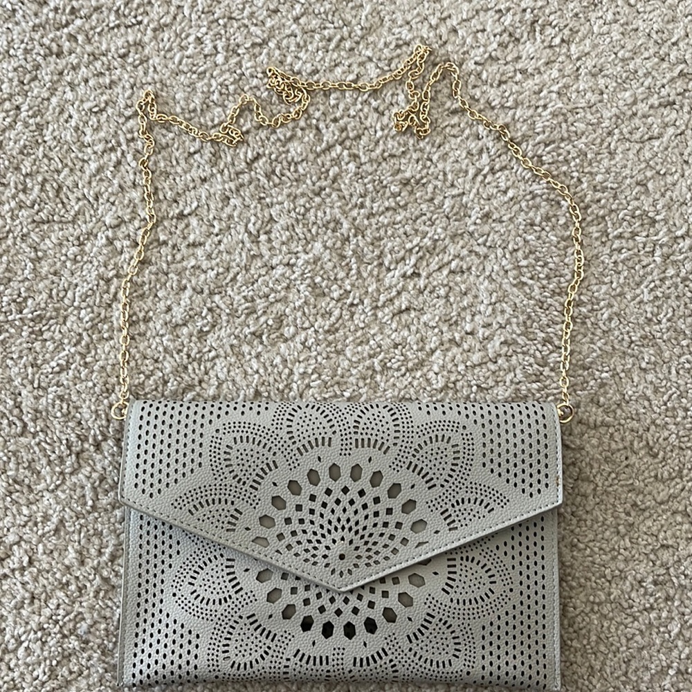 Never used adorable grey clutch/purse (removable gold strap)